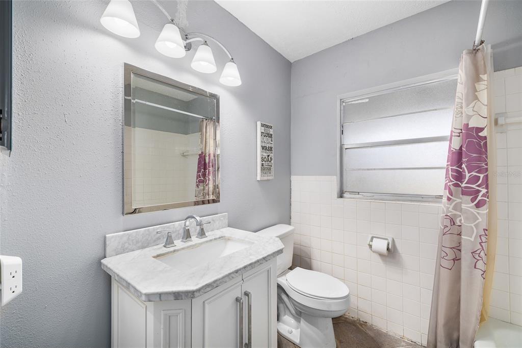 2027 Pinecrest Way Clearwater, FL 33755 - Photo 29 of 47 a bathroom with a sink toilet and shower