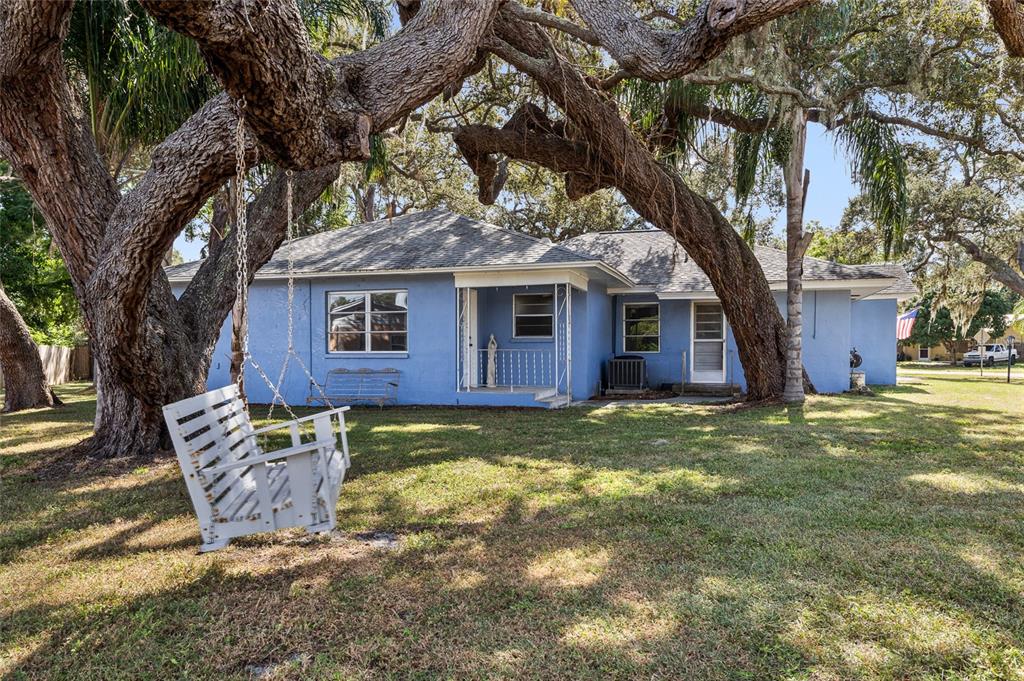 2027 Pinecrest Way Clearwater, FL 33755 - Photo 7 of 47 a backyard of a house with yard table and chairs