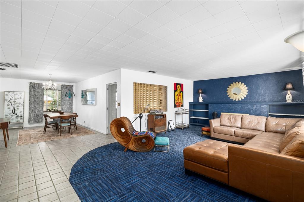 2027 Pinecrest Way Clearwater, FL 33755 - Photo 9 of 47 a living room with furniture and a fireplace