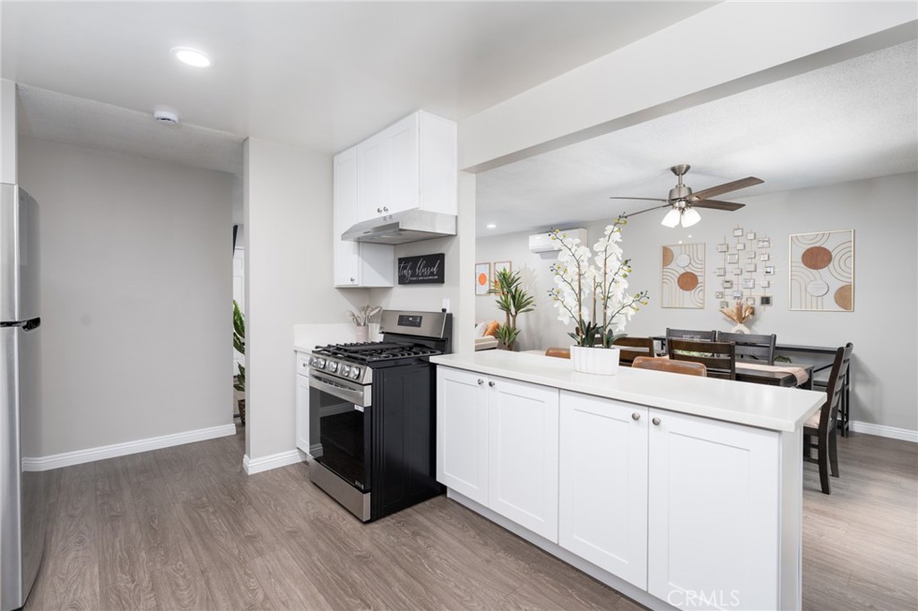 716 Orange Street Riverside, CA 92501 - Photo 12 of 28 a kitchen with white cabinets and appliances