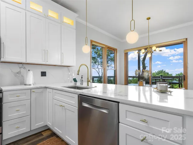 a kitchen with a sink window and cabinets