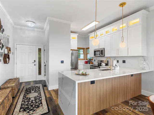 a kitchen with a sink stove and cabinets
