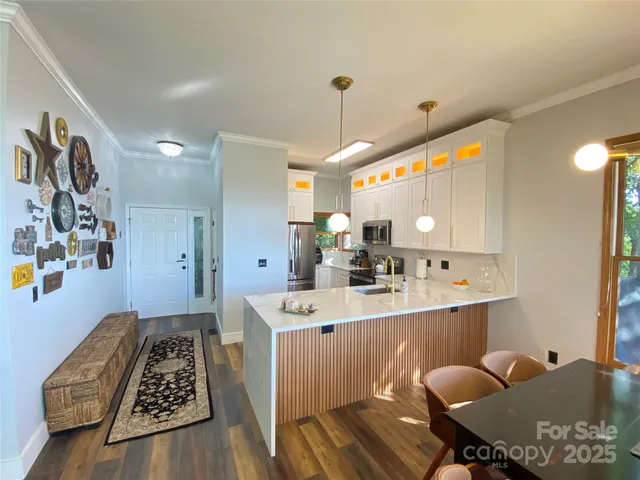 a large kitchen with a table and chairs