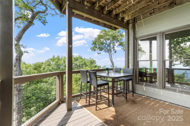 a view of a porch with chairs and backyard