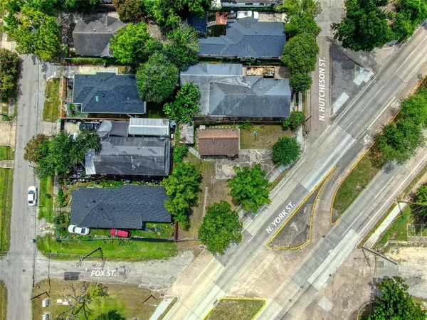 an aerial view of a house with a garden and plants