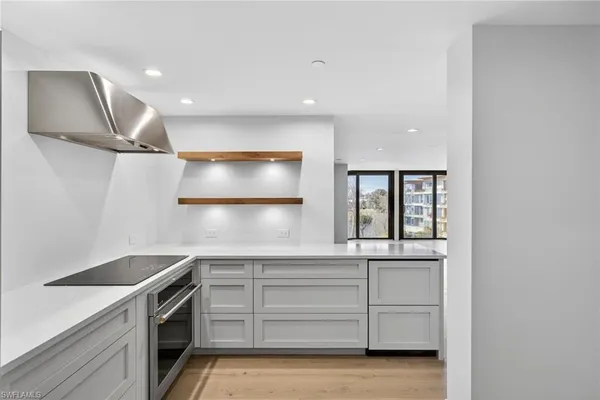 a kitchen that has a sink and a stove