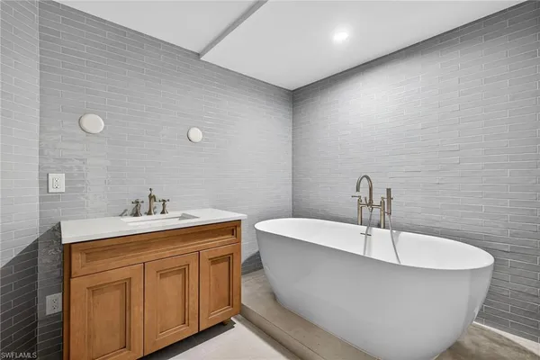 a bathroom with a sink and a bathtub