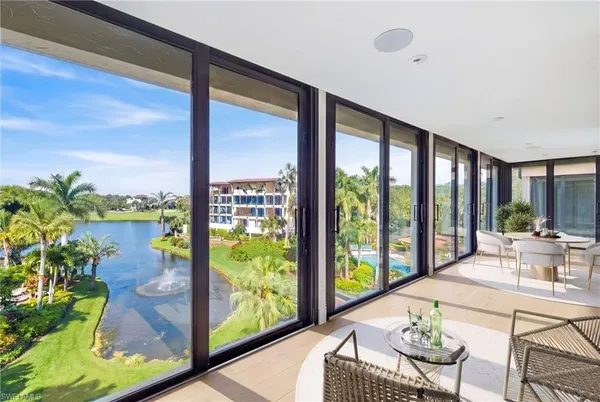 a living room with large windows