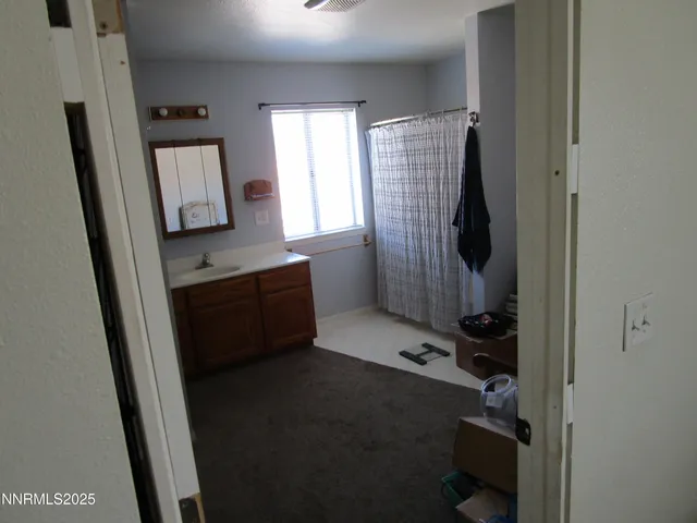 a room with window and mirror