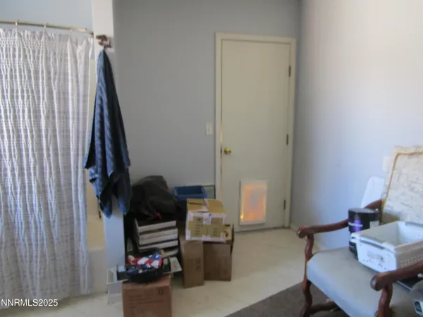 a view of livingroom with furniture and refrigerator
