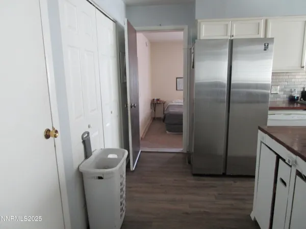a view of hallway with wooden floor