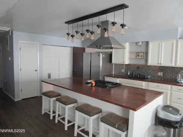 a kitchen with a table and chairs in it