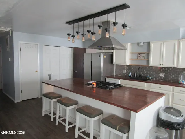 a kitchen with a table and chairs in it