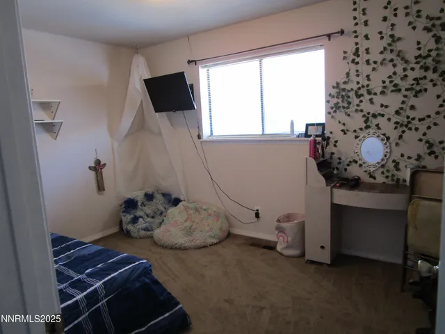 a room with a wooden floor and a chair