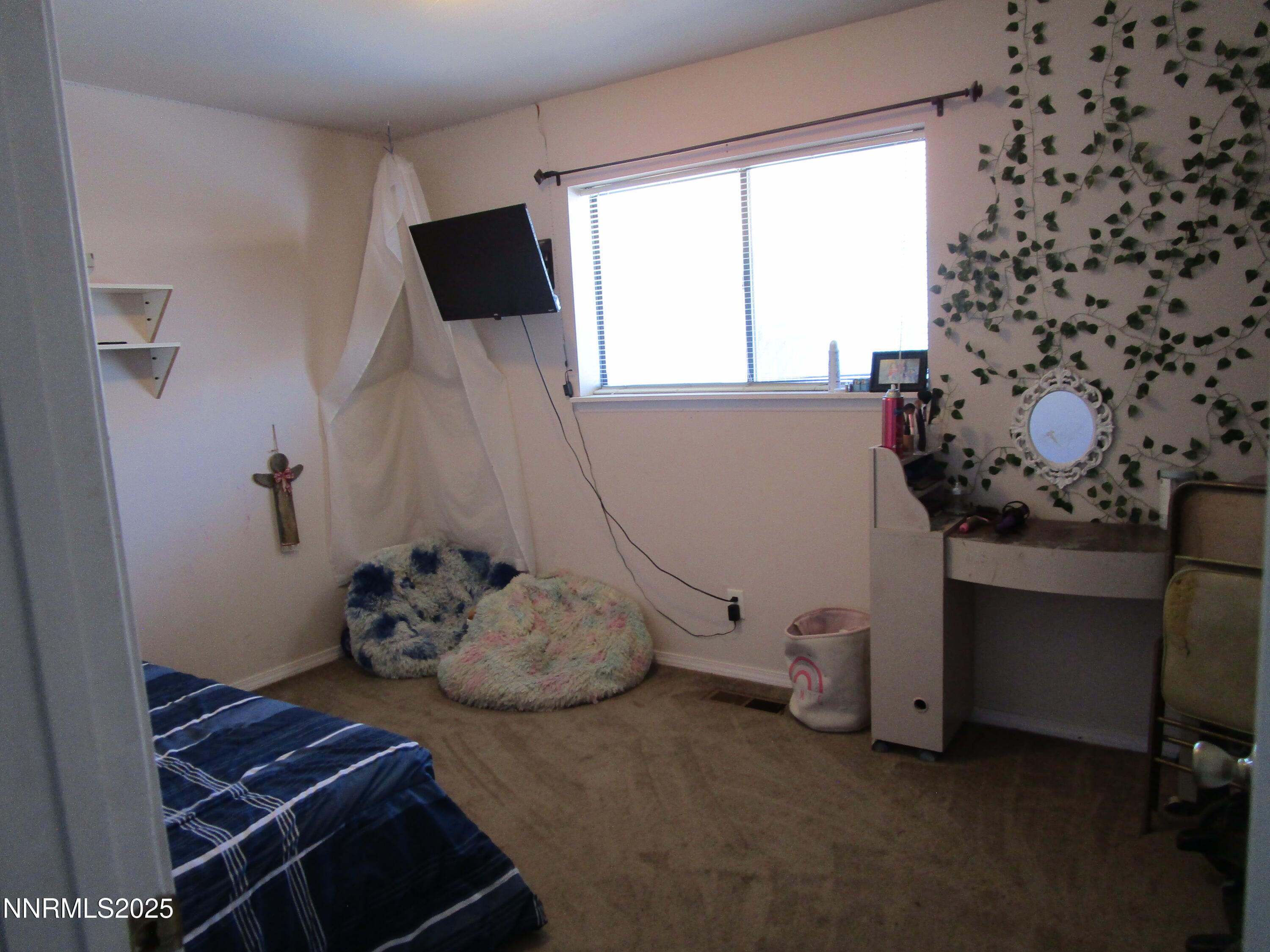 1091 Tiffany Drive Fallon, NV 89406 - Photo 21 of 31 a room with a wooden floor and a chair