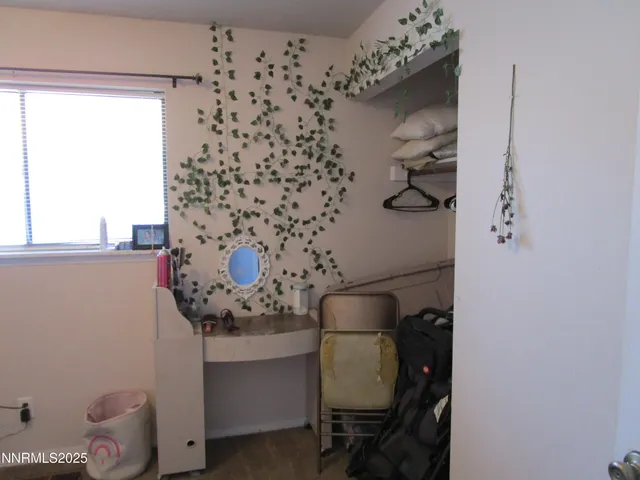 a view of a hallway with washer and dryer