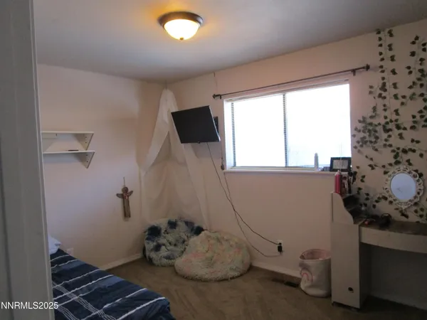 a room with toys and wooden floor