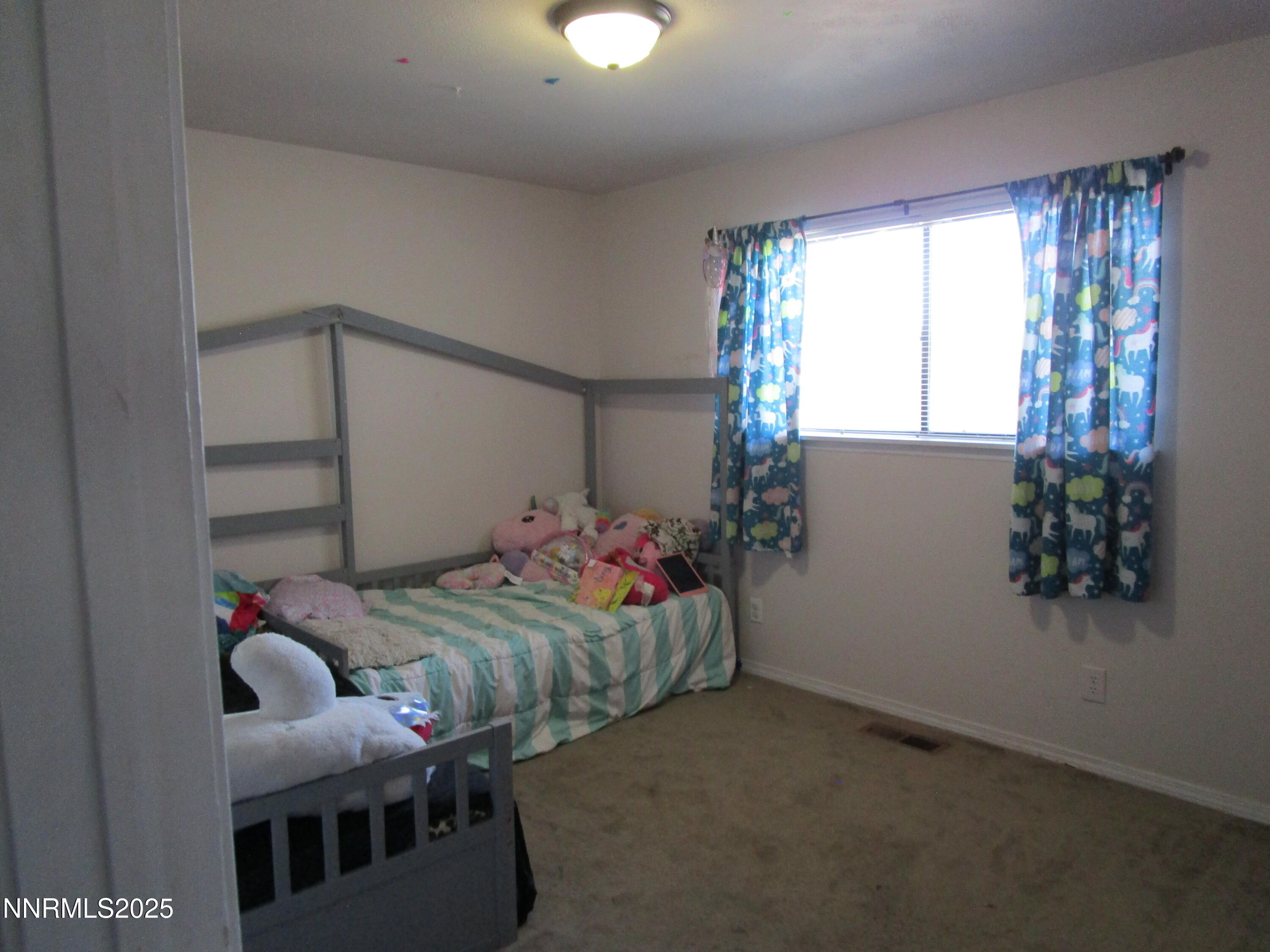 1091 Tiffany Drive Fallon, NV 89406 - Photo 29 of 31 a bedroom with bed and a window