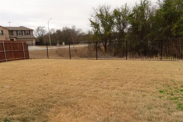 a view of an outdoor space and tennis court