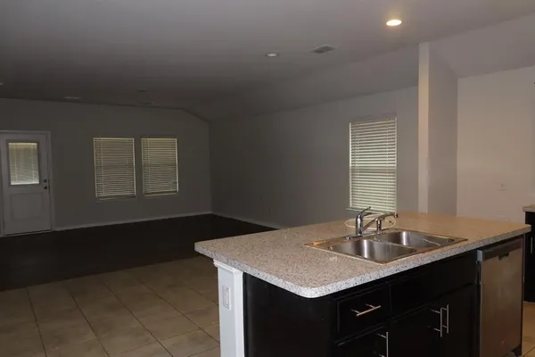 a bathroom with a sink vanity and a mirror