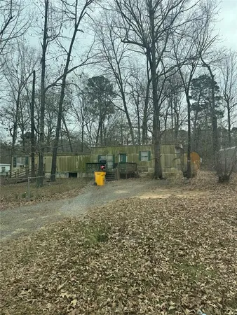 a view of a outdoor space with deck and trees