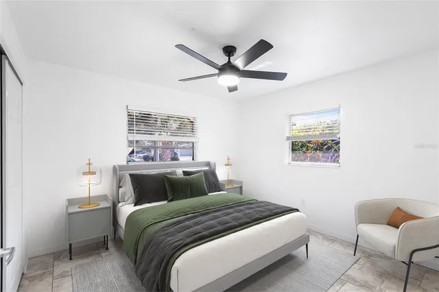 a bedroom with a bed and chair