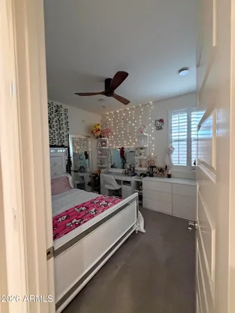 a bed room with a bed furniture and a large window