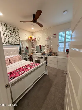 a livingroom with workspace and a window