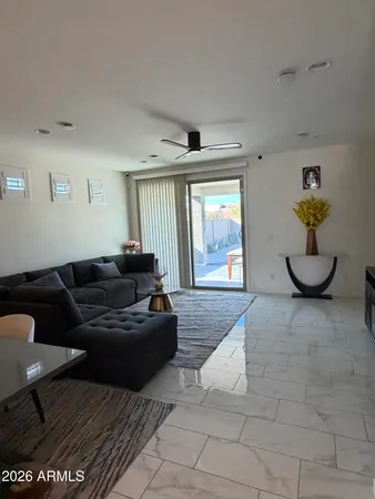 a living room with furniture and a window