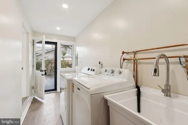a utility room with dryer and washer