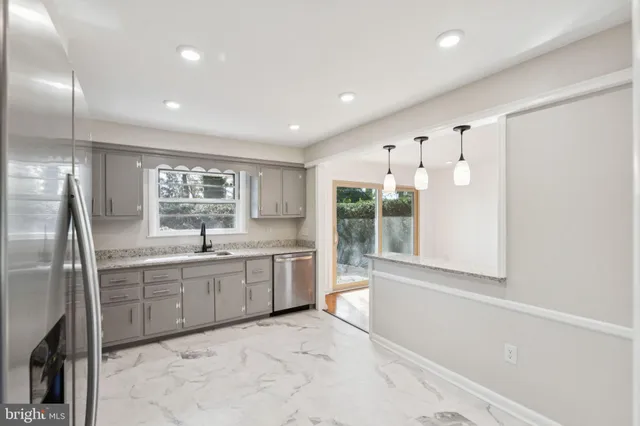 a large bathroom with a large tub and sink