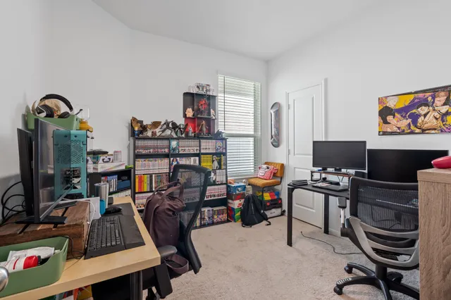 a view of a workspace with furniture and toys