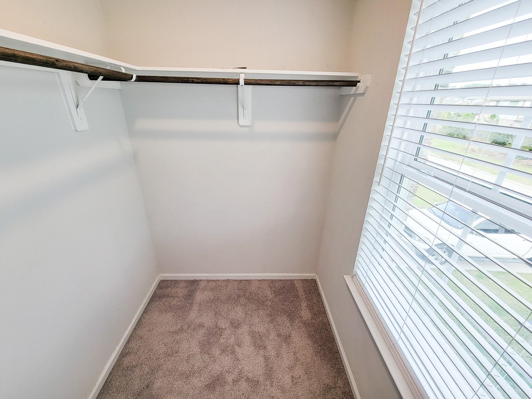 94 Valiant Ridge Trail Magnolia, TX 77354 - Photo 34 of 47 a view of a room with racks on the wall