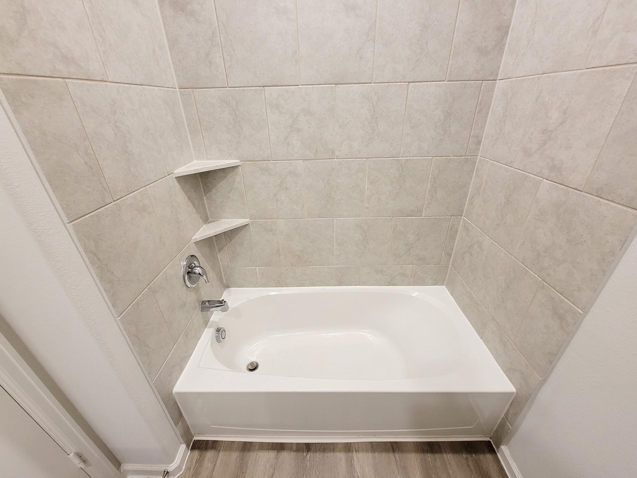 94 Valiant Ridge Trail Magnolia, TX 77354 - Photo 41 of 47 a bathroom with a bathtub