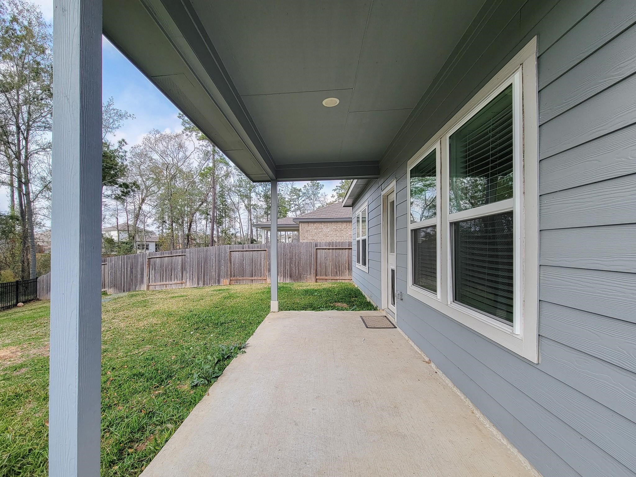 94 Valiant Ridge Trail Magnolia, TX 77354 - Photo 43 of 47 a view of a porch with garden