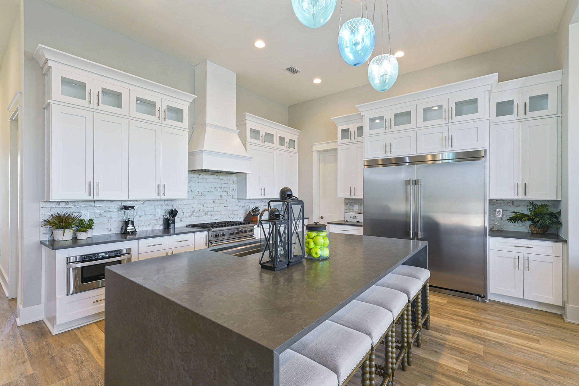 336 South Holiday Road Destin, FL 32550 - Photo 12 of 40 a kitchen with a dining table chairs and refrigerator