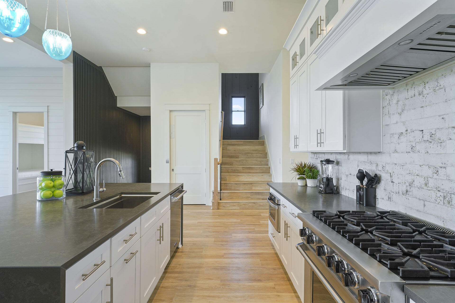 336 South Holiday Road Destin, FL 32550 - Photo 13 of 40 a kitchen with sink a stove and cabinets
