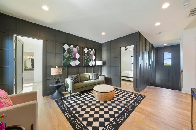 a living room with furniture and a rug