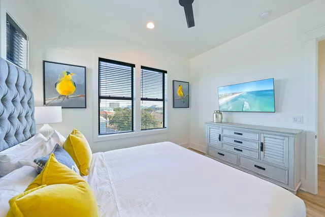 a bedroom with a bed and a dresser