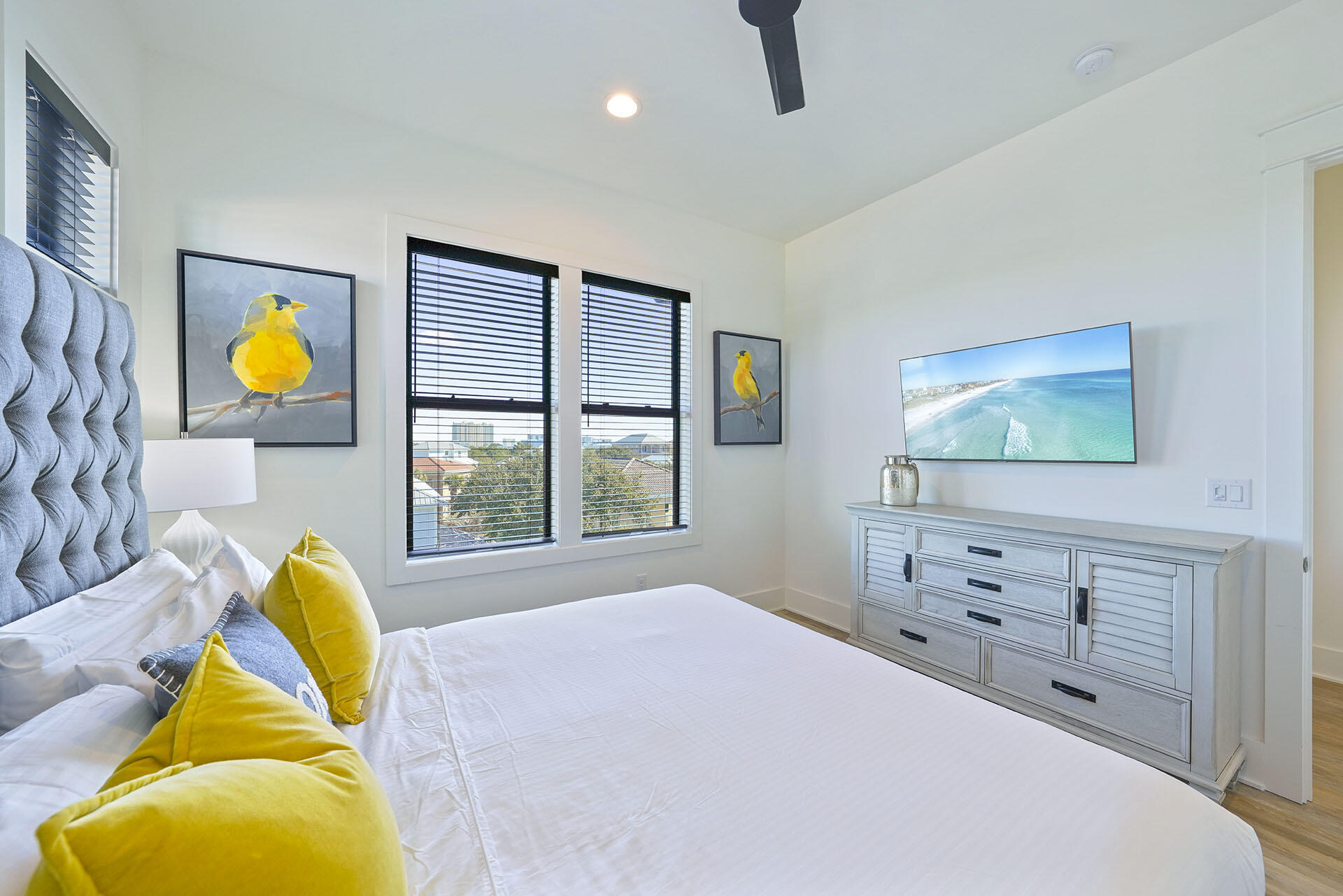 336 South Holiday Road Destin, FL 32550 - Photo 22 of 40 a bedroom with a bed and a dresser