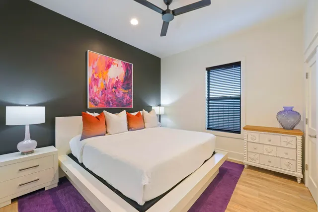 a bedroom with a bed and a dresser