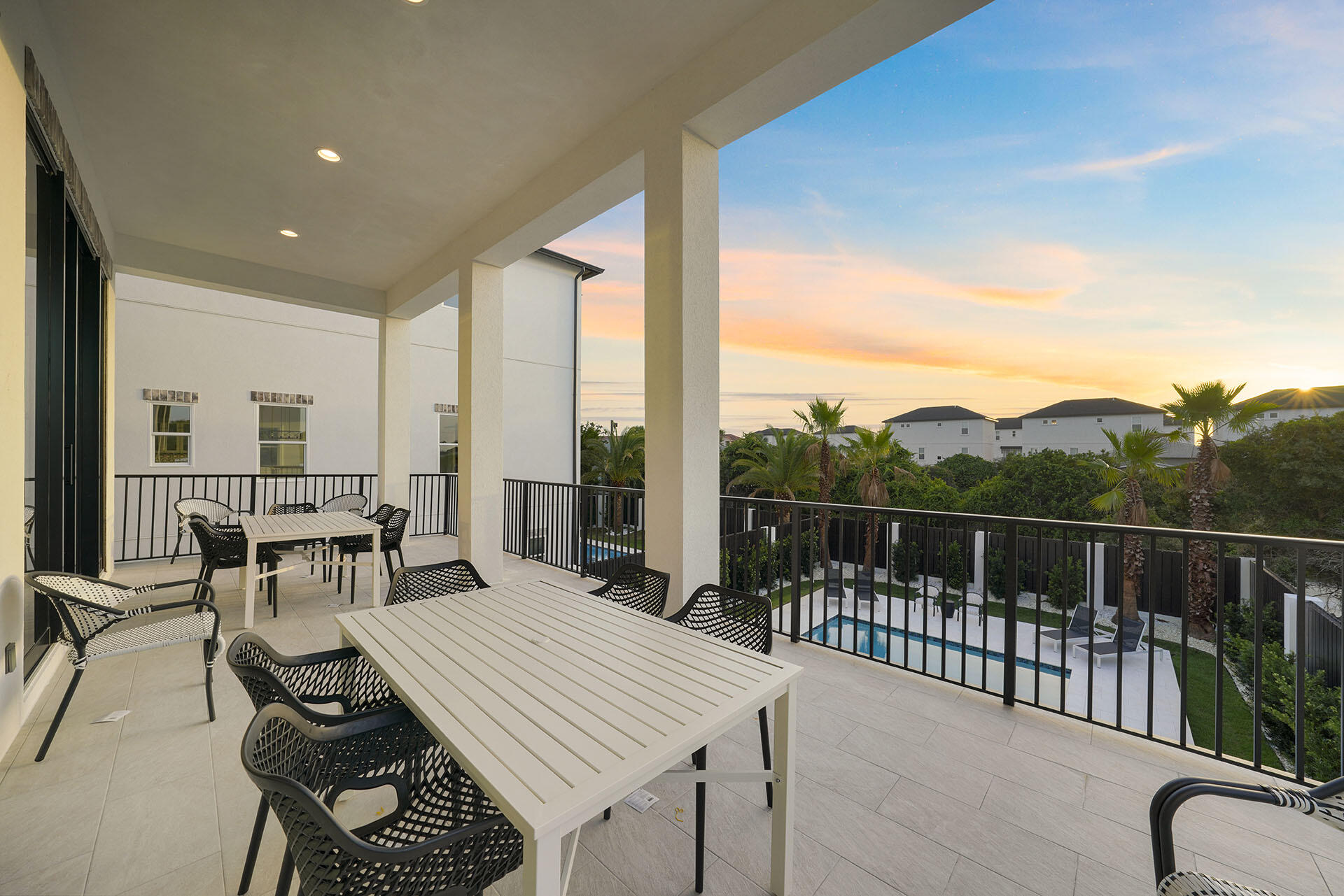 336 South Holiday Road Destin, FL 32550 - Photo 29 of 40 a view of a balcony dining table and chairs