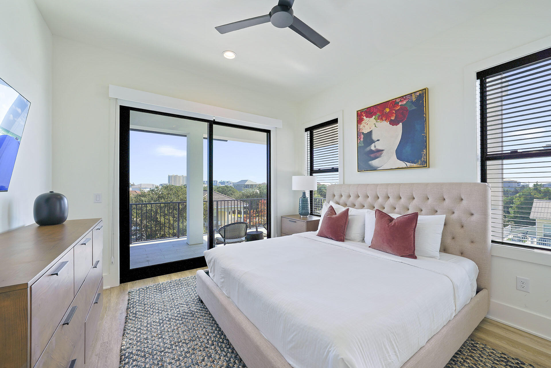 336 South Holiday Road Destin, FL 32550 - Photo 31 of 40 a bedroom with a large bed and a large window