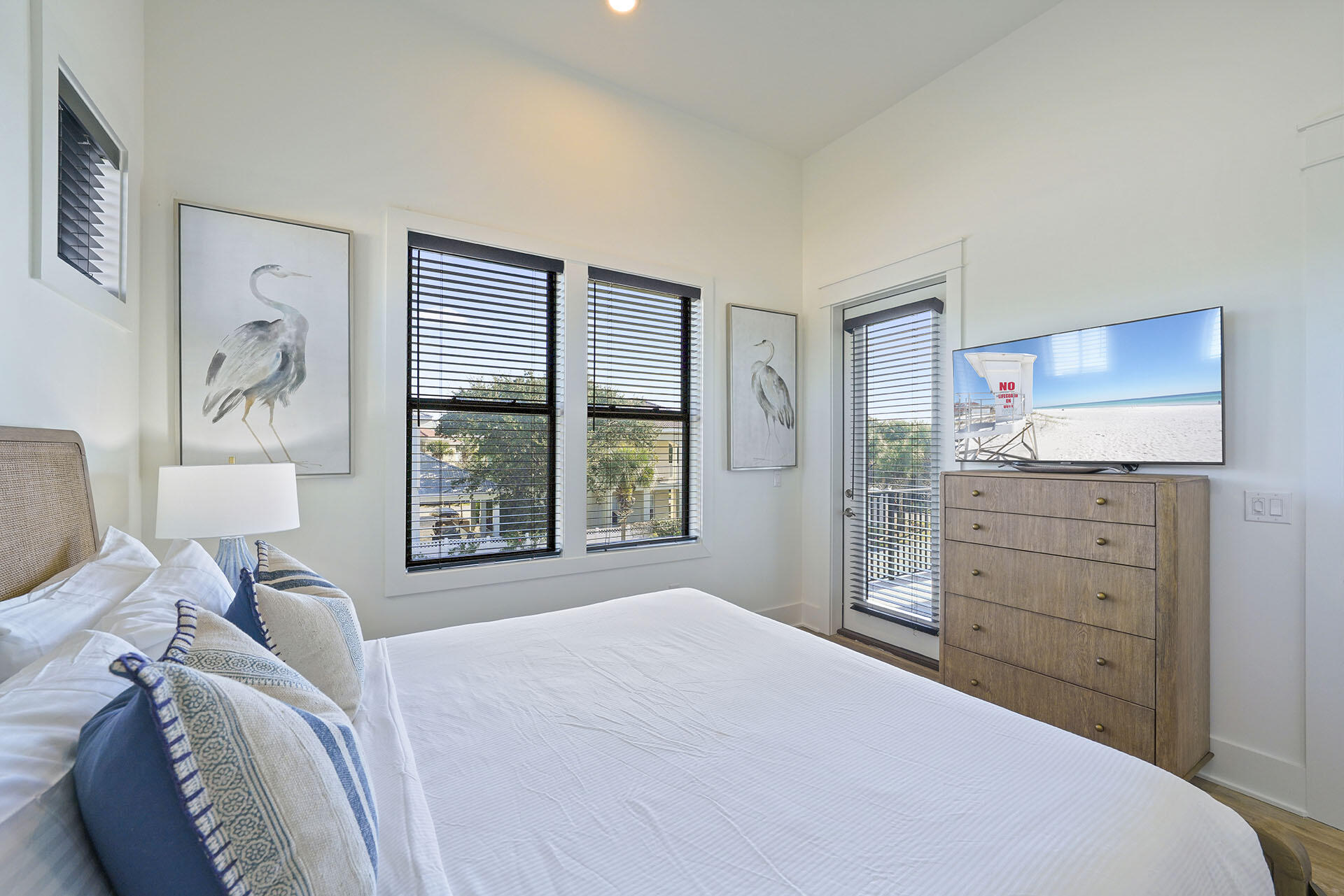 336 South Holiday Road Destin, FL 32550 - Photo 32 of 40 a bedroom with a bed and a dresser