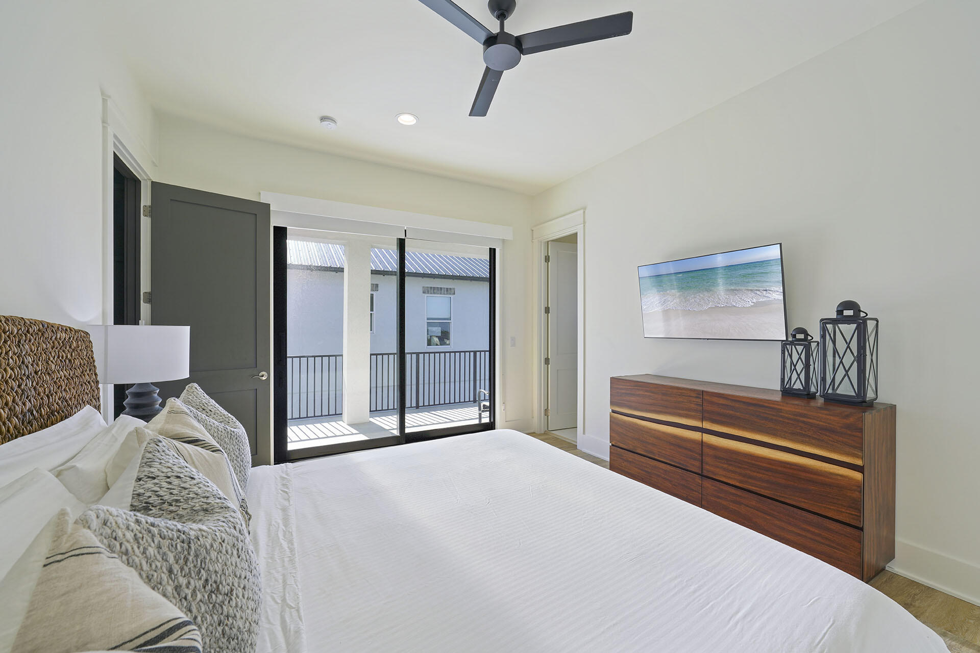 336 South Holiday Road Destin, FL 32550 - Photo 34 of 40 a bedroom with a bed and a chandelier