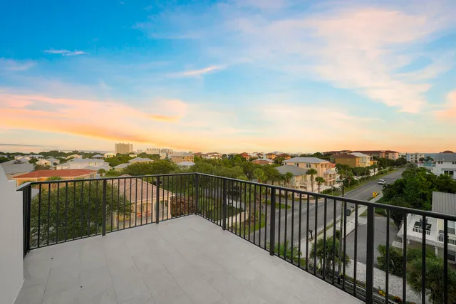 a view of city and mountain from a balcony