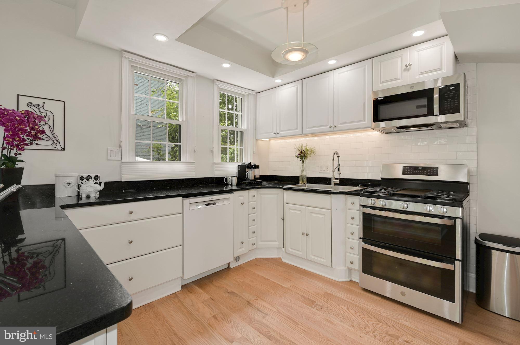 1391 D Street Northeast Washington, DC 20002 - Photo 10 of 39 Brand new stove, microwave, sink and upper cabinet
