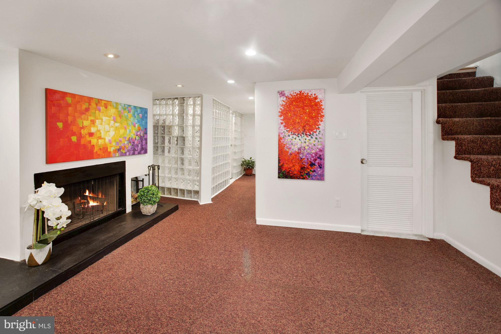 1391 D Street Northeast Washington, DC 20002 - Photo 21 of 39 Finished lower level, wood burning fireplace