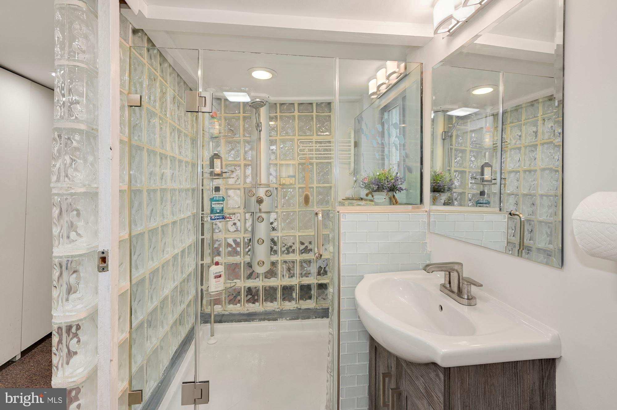 1391 D Street Northeast Washington, DC 20002 - Photo 24 of 39 Lower level full Bath, new vanity, mirror, toilet