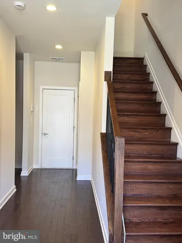 a view of entryway with wooden floor
